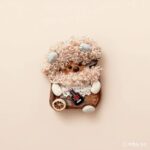 Detail shot of Pod Doll’s face and curls