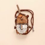 Gallery detail of the finished Pod Doll showing texture and sunburst design