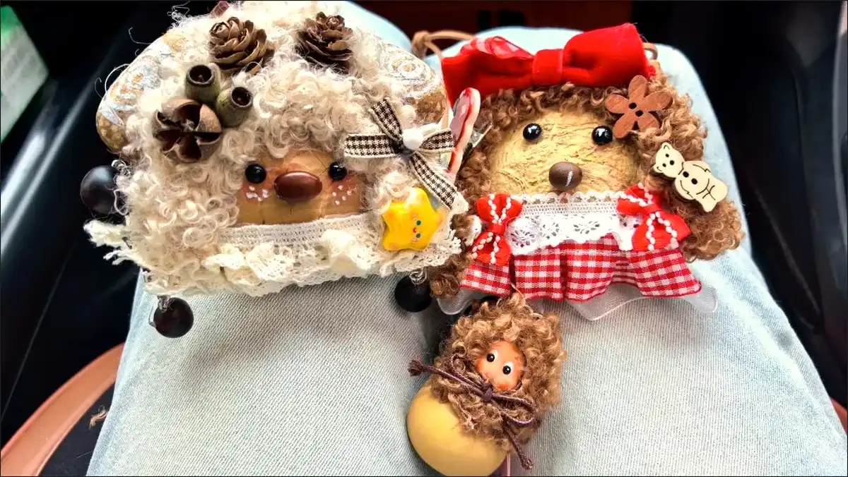 Customer photo of two handmade pod dolls and a small hanging piece