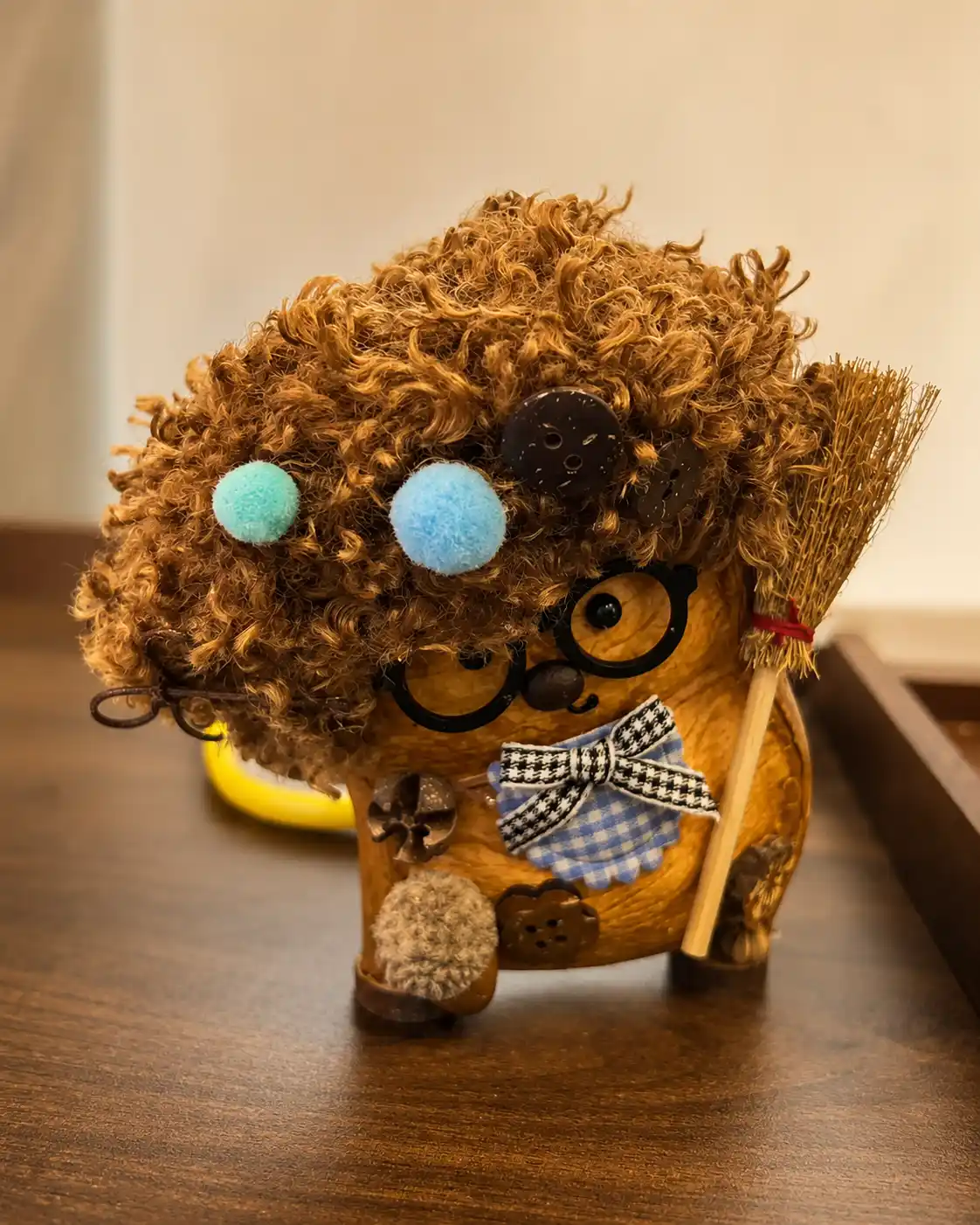 Handmade collectible displayed in a cozy desk corner