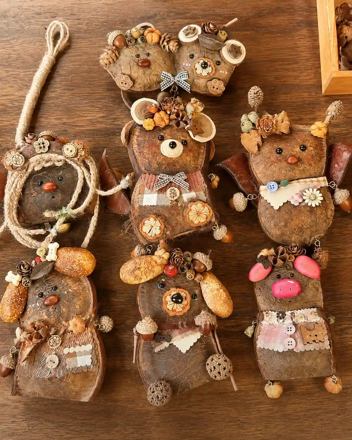 A group of handmade Poddolls collectible characters made from natural seed pod shells.