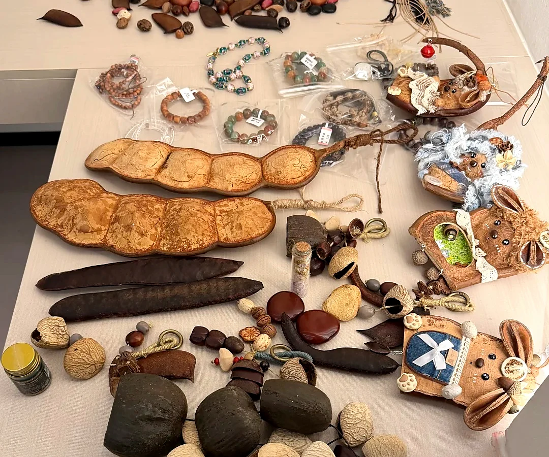 Natural seed pods and handmade materials used for pod dolls
