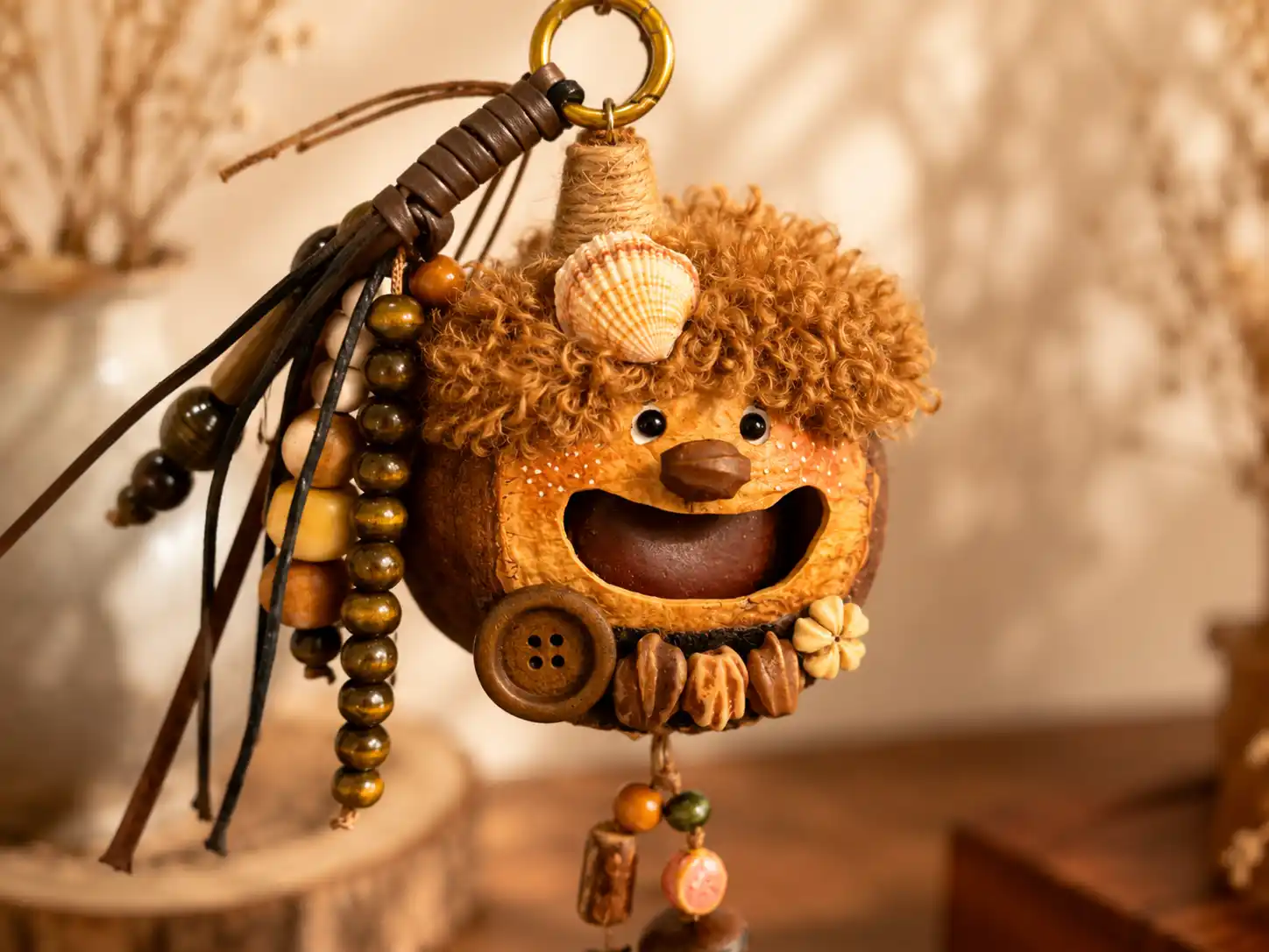 Close-up of a handmade Poddoll with a natural seed pod shell and small attached decorative details