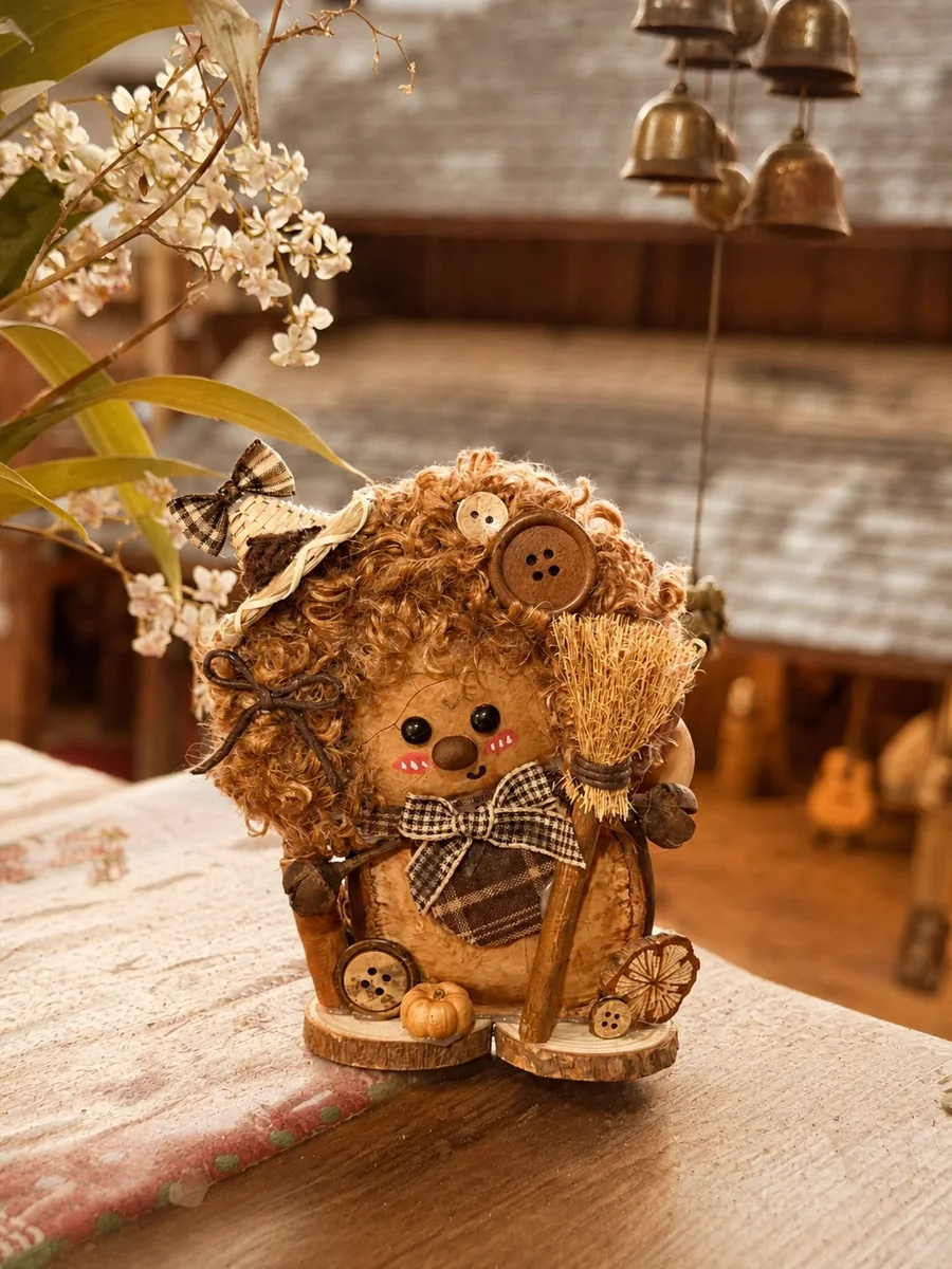 Handmade pod doll displayed on a tabletop as nature-inspired indoor decor