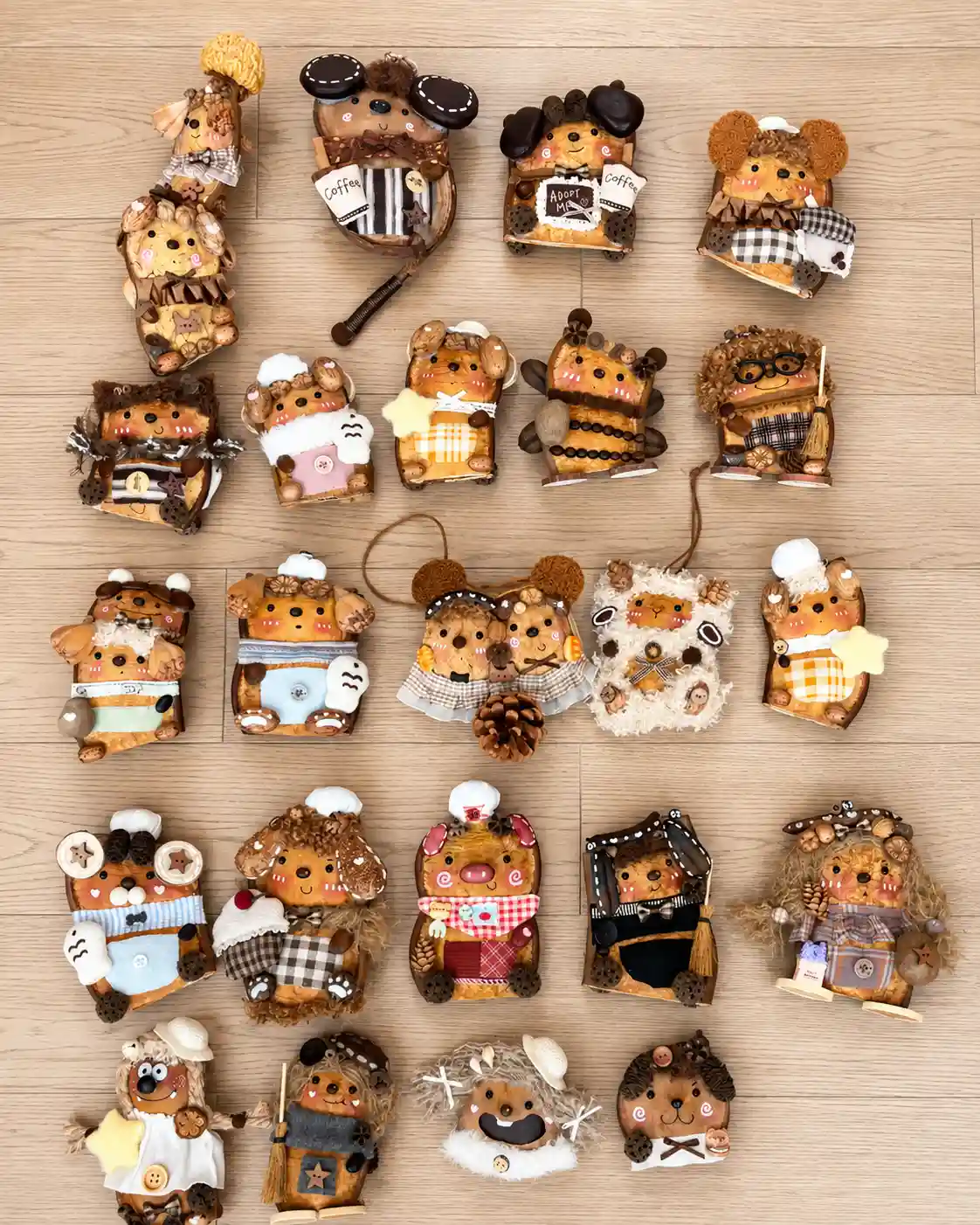 Collection of handmade Poddolls with different faces, clothing, ears, props, and natural shell shapes
