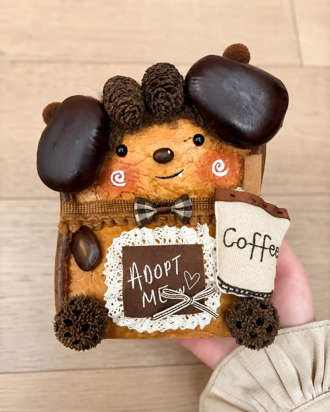 Handmade coffee-themed dog-like Poddoll holding an Adopt Me sign and a fabric coffee cup