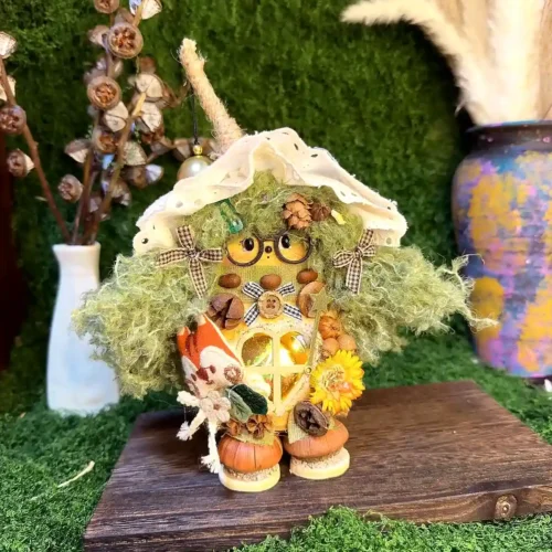 Handmade Poddoll figurine displayed on a wooden shelf