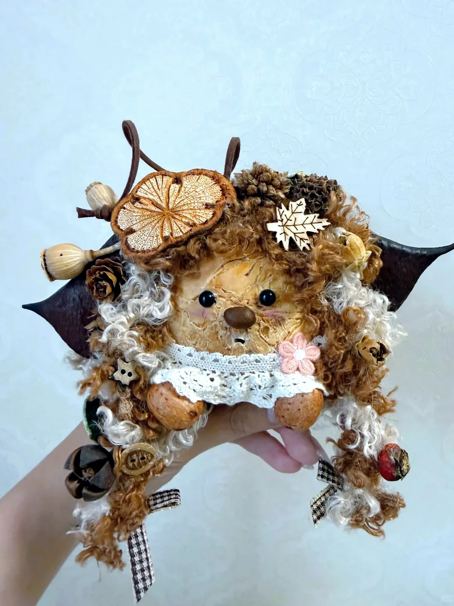 Handmade fairy-style Poddoll with long curly hair and botanical details