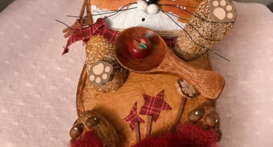 Handmade fox Poddoll displayed on a chair with woodland-inspired details
