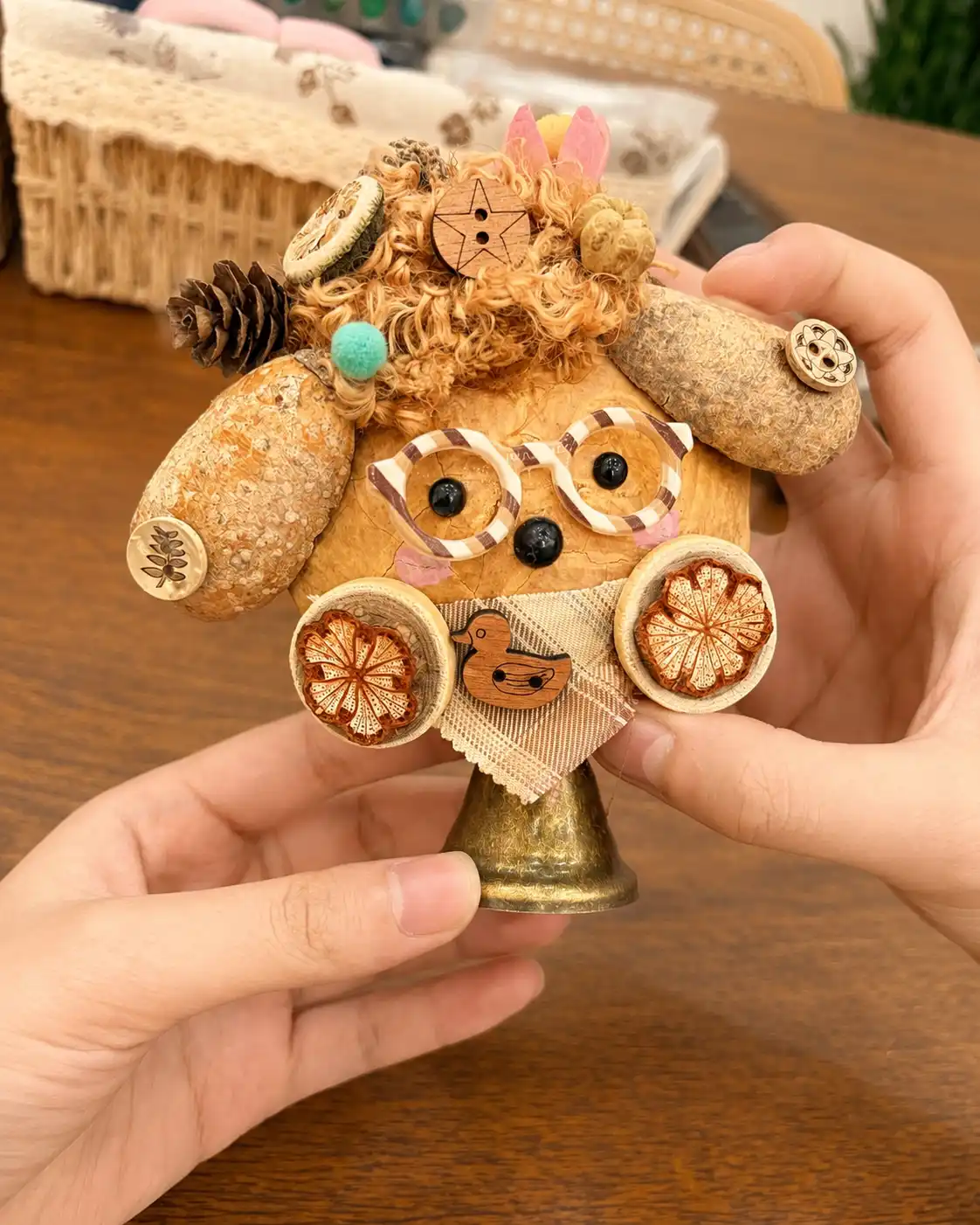 Handmade dog-style Poddoll with glasses, curly hair, fabric, and natural details