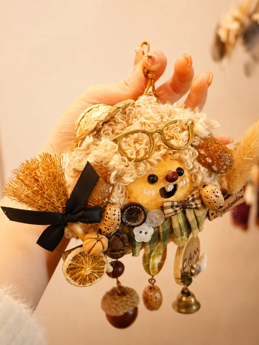 Handmade Poddoll with curly white hair, glasses, a tiny broom, and natural details