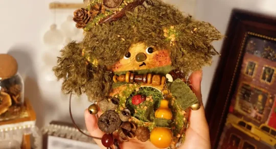Handmade Poddoll collectible displayed in a cozy indoor space