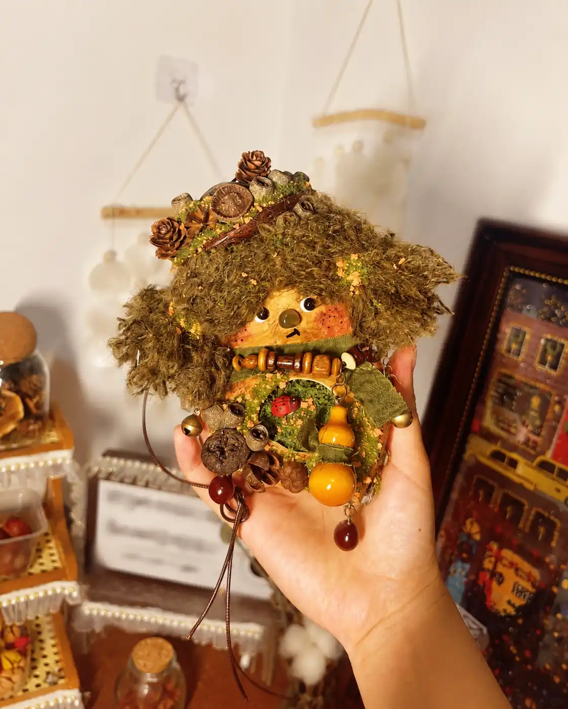Handmade Poddoll collectible displayed in a cozy indoor space