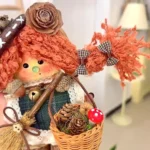 Close-up handmade Poddoll detail with fabric, basket, pinecones, and tiny accessories