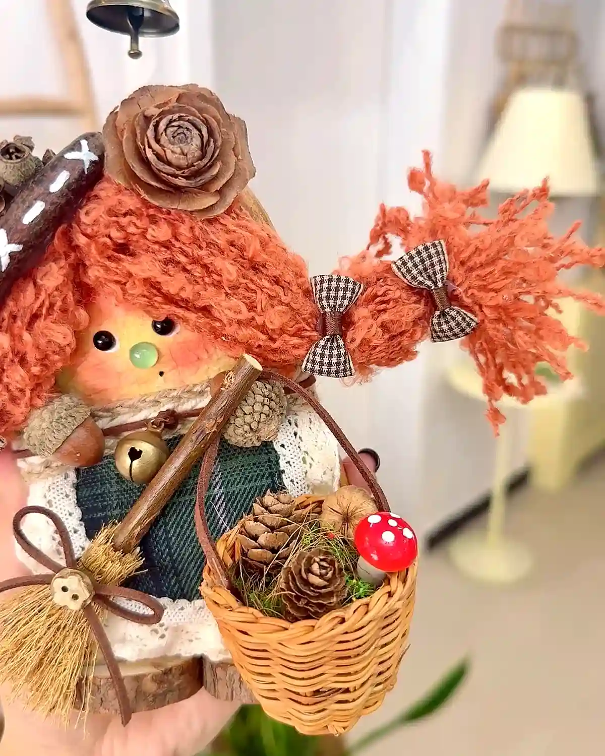 Close-up handmade Poddoll detail with fabric, basket, pinecones, and tiny accessories