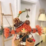 Handmade figurine-style Poddoll held in a cozy indoor display setting