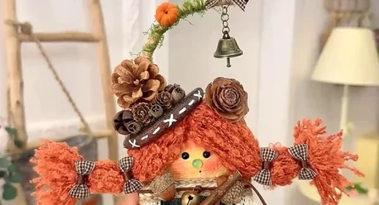 Handmade figurine-style Poddoll held in a cozy indoor display setting
