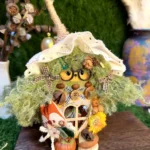 Close-up handmade Poddoll figurine with natural seed pod texture and tiny details