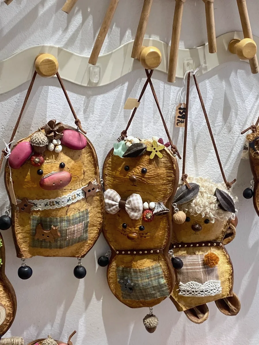 Hanging handmade Poddolls with different strange little character faces