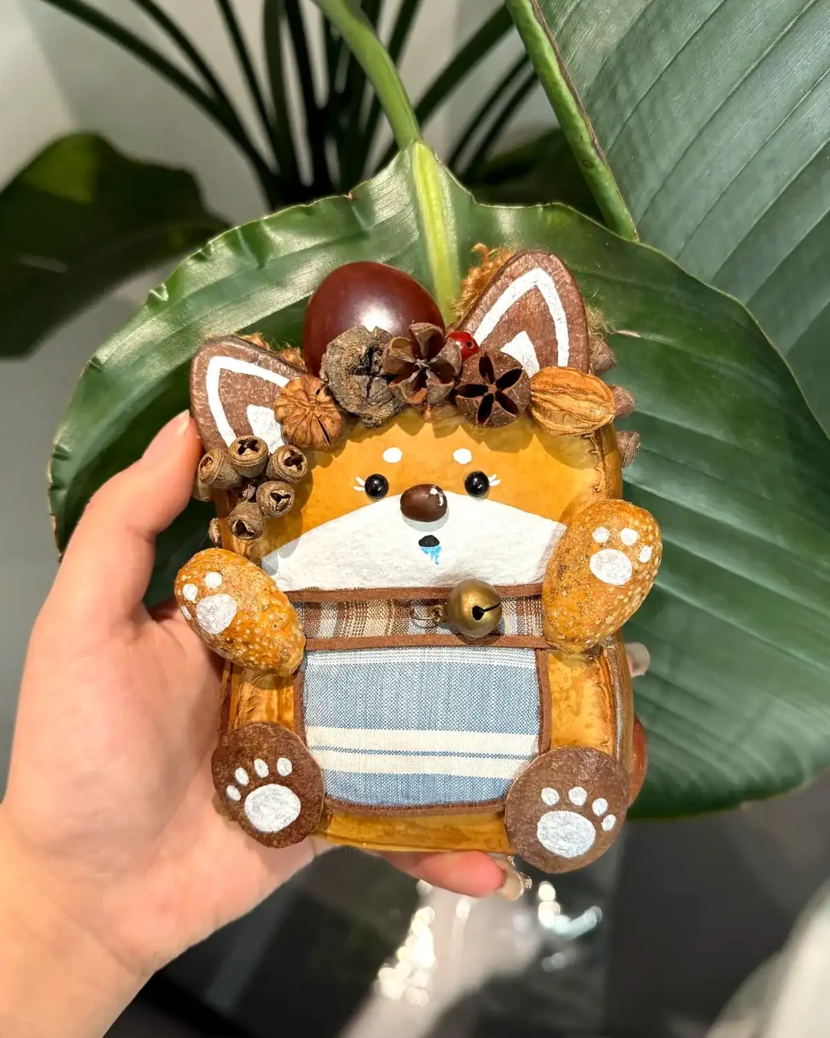 Personal handmade Poddoll gift with fabric, seed pod texture, and tiny character details
