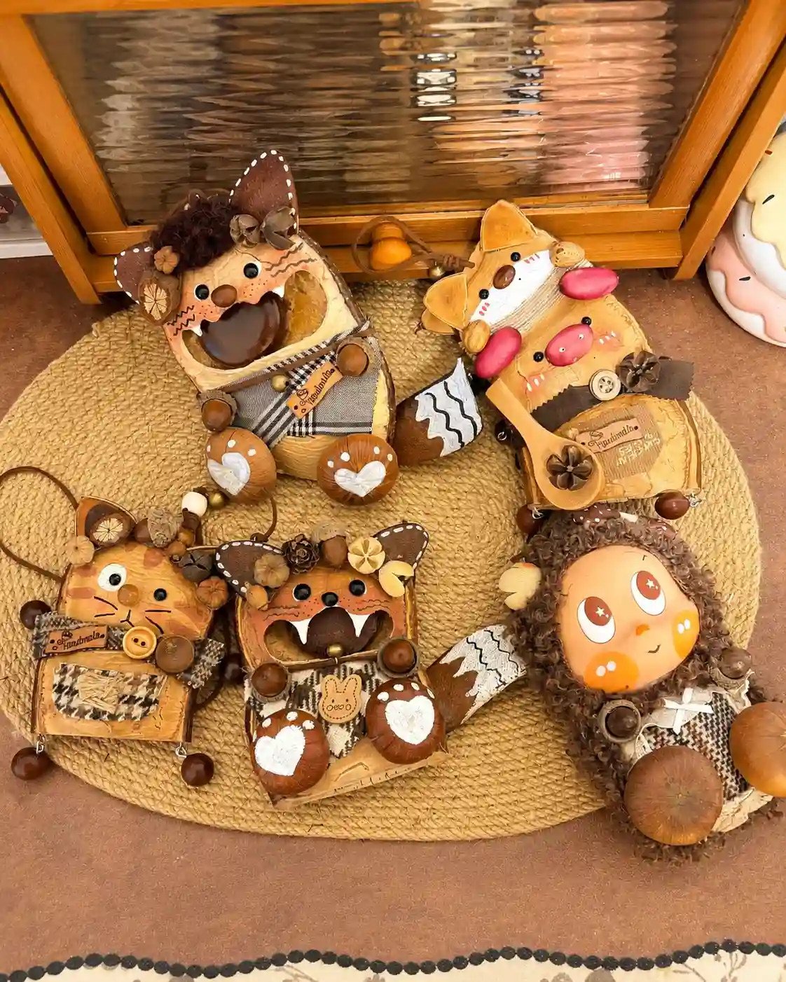 Six handmade Poddoll characters with different faces, shapes, clothing, and natural details arranged together