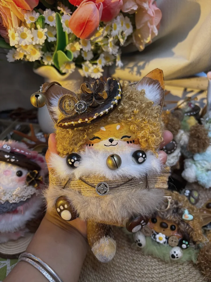 Strange cute handmade cat Poddoll with hat and natural shell details