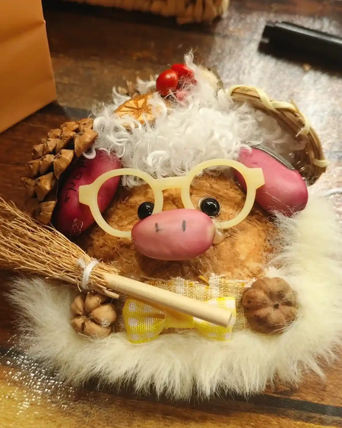Thoughtful handmade Poddoll displayed on a warm wooden table