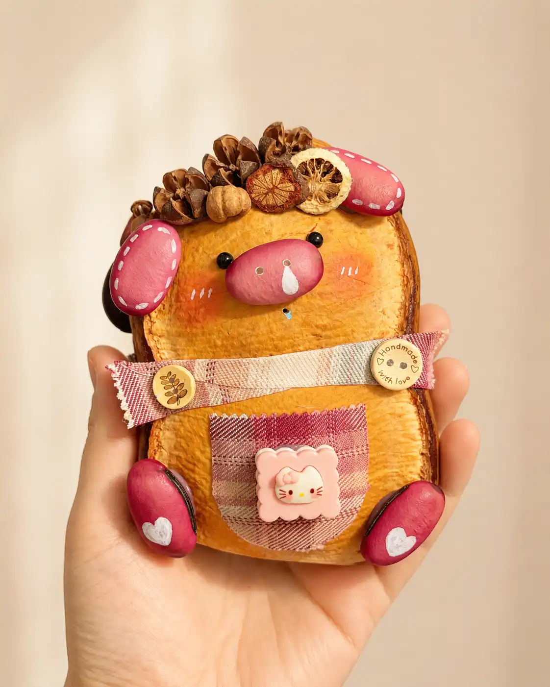 Thoughtful small handmade Poddoll gift held in one hand