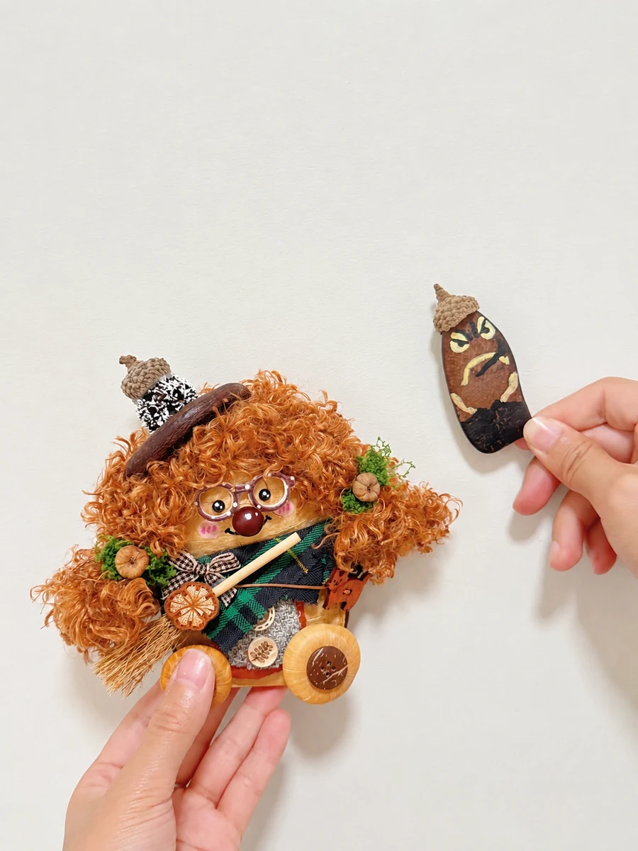 Handmade Poddoll character shown with a small painted pod companion