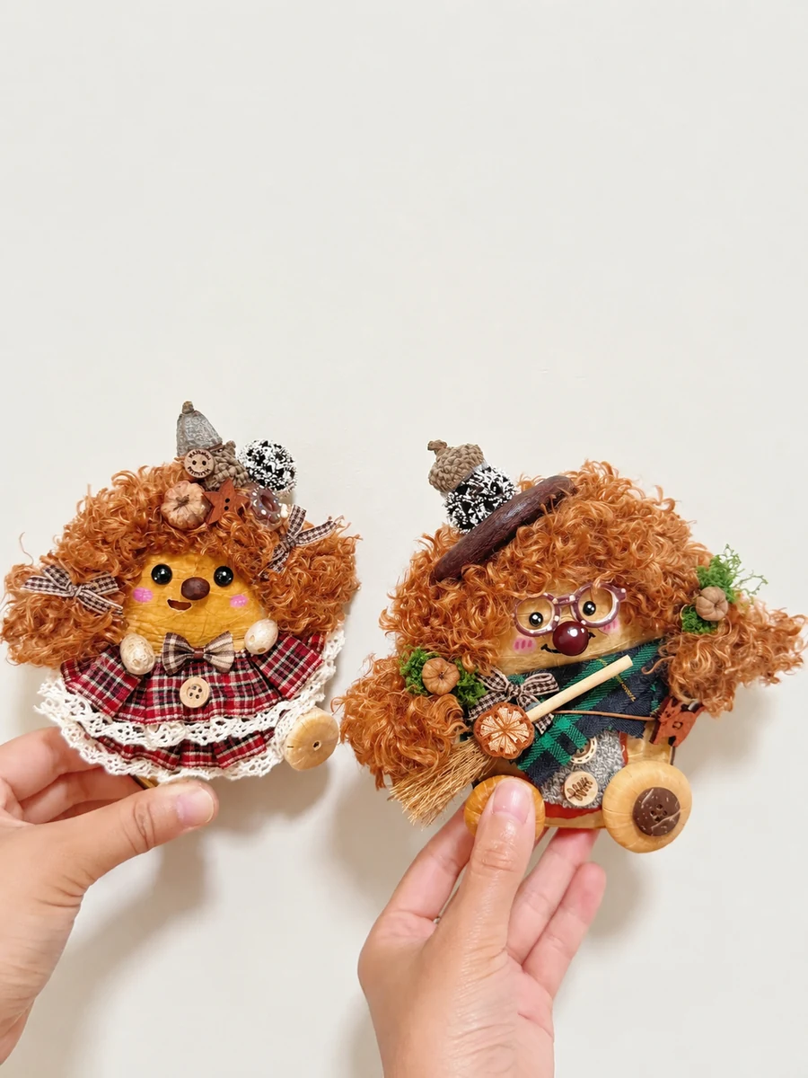 Two finished handmade Poddolls with different hair, clothing, and character details